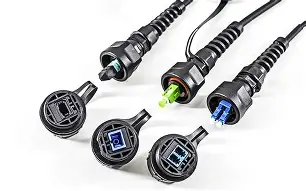 Close-up of ruggedized fiber-optic connector in harsh environment